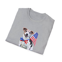 Folded T-shirt featuring a cute  puppy wearing an American flag bow tie and holding a small U.S. flag, with the phrase 'Born to Be Free' printed below the image.