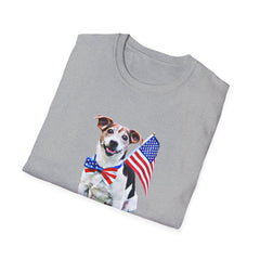 Folded T-shirt featuring a cute  puppy wearing an American flag bow tie and holding a small U.S. flag, with the phrase 'Born to Be Free' printed below the image.
