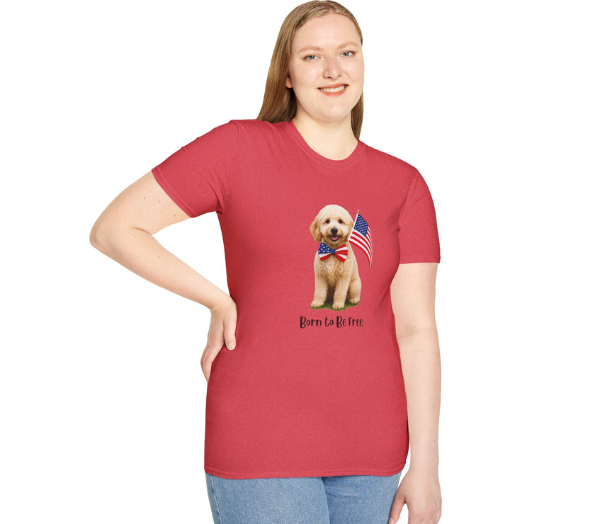 Female wearing T-shirt featuring a cute golden doodle puppy wearing an American flag bow tie and holding a small U.S. flag, with the phrase 'Born to Be Free' printed below the image.