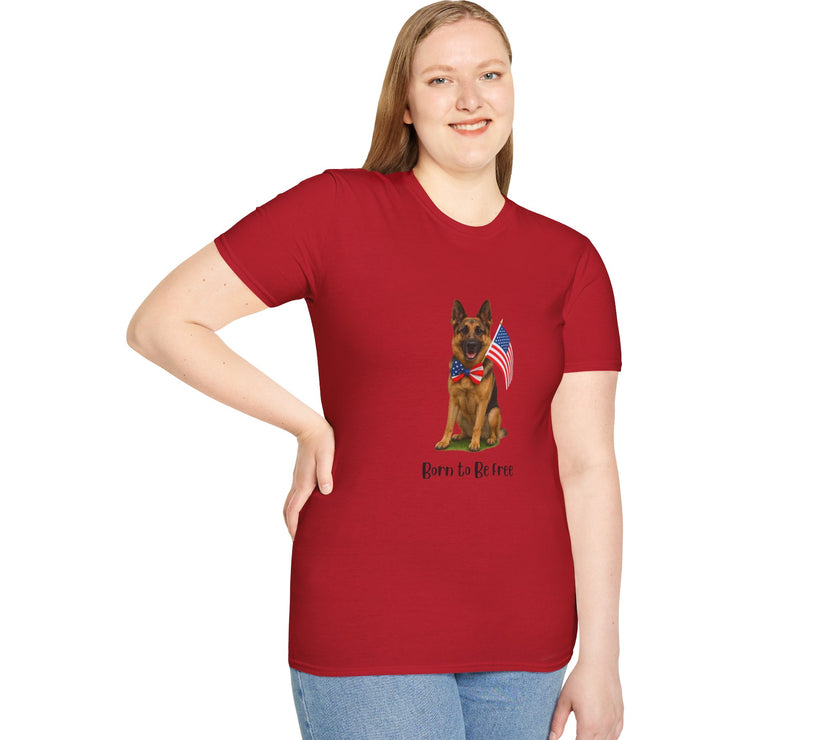 Cherry Red t-shirt featuring a patriotic German Shepherd wearing an American flag bowtie and holding U.S. flags, with the phrase "Born to Be Free" printed below — perfect for dog lovers and patriotic Americans.