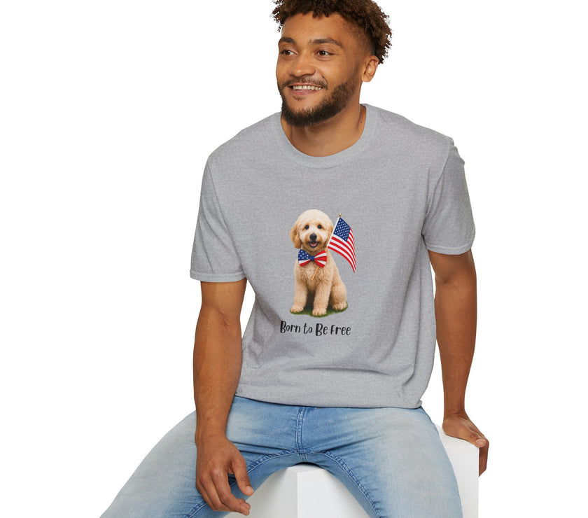 Male wearing T-shirt featuring a cute golden doodle puppy wearing an American flag bow tie and holding a small U.S. flag, with the phrase 'Born to Be Free' printed below the image.