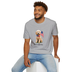 Male wearing T-shirt featuring a cute golden doodle puppy wearing an American flag bow tie and holding a small U.S. flag, with the phrase 'Born to Be Free' printed below the image.