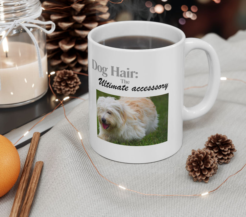White ceramic mug featuring a photo of dogs lying on grass, with the humorous quote "Dog Hair: The Ultimate Accessory" printed below the image.