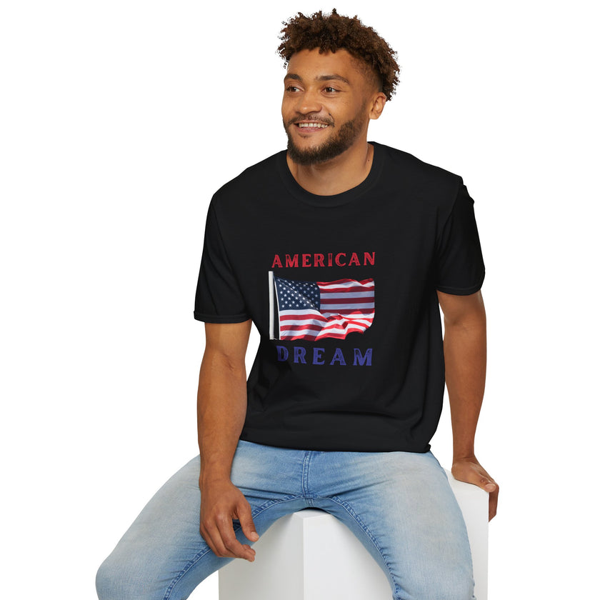 Male wearing T-shirt featuring an American flag graphic with the words 'AMERICAN DREAM' in red and blue text above and below the flag