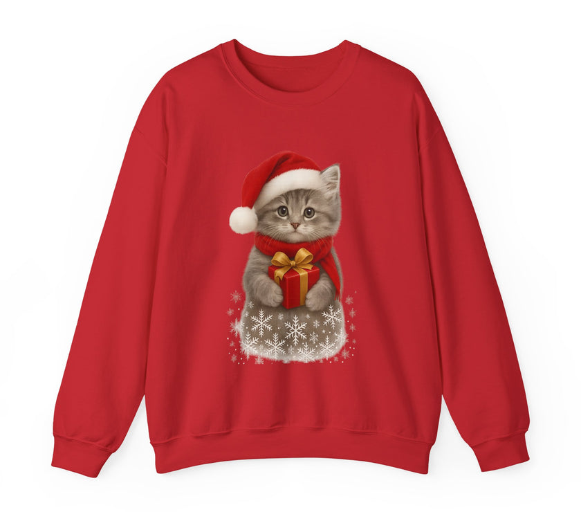 Red sweatshirt featuring a gray kitten wearing a Santa hat and red scarf, holding a small red gift box with a gold bow, surrounded by snowflake designs.
