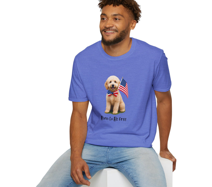 Male wearing T-shirt featuring a cute golden doodle puppy wearing an American flag bow tie and holding a small U.S. flag, with the phrase 'Born to Be Free' printed below the image.