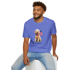 Male wearing T-shirt featuring a cute golden doodle puppy wearing an American flag bow tie and holding a small U.S. flag, with the phrase 'Born to Be Free' printed below the image.