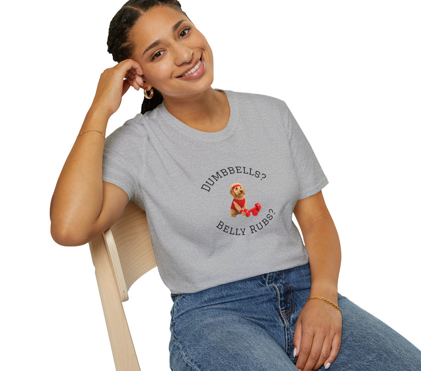 Person wearing a gray t-shirt with a graphic and text, sitting on a chair.
