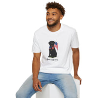 White t-shirt featuring a patriotic Black Lab wearing an American flag bowtie and holding U.S. flags, with the Black Labphrase "Born to Be Free" printed below — perfect for dog lovers and patriotic Americans.