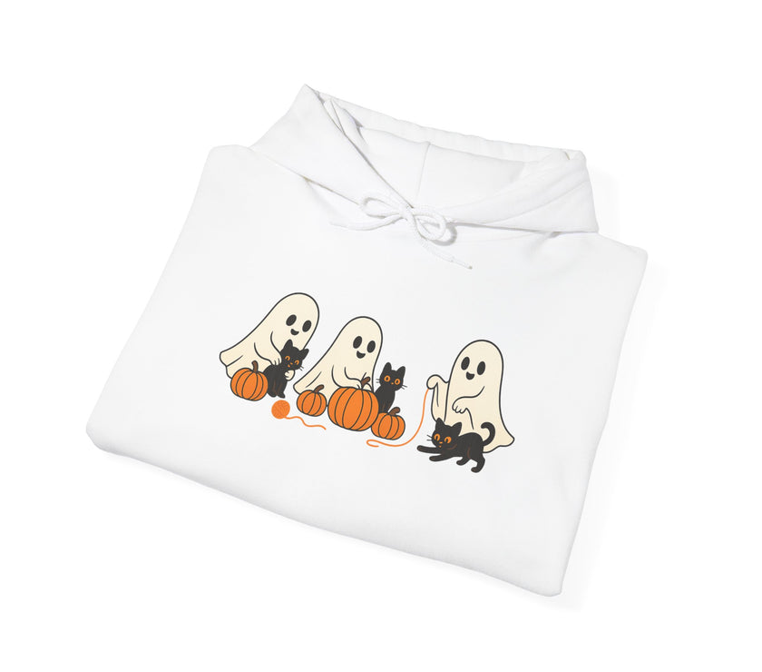 Folded white garment with Halloween-themed design featuring ghosts and cats on pumpkins.