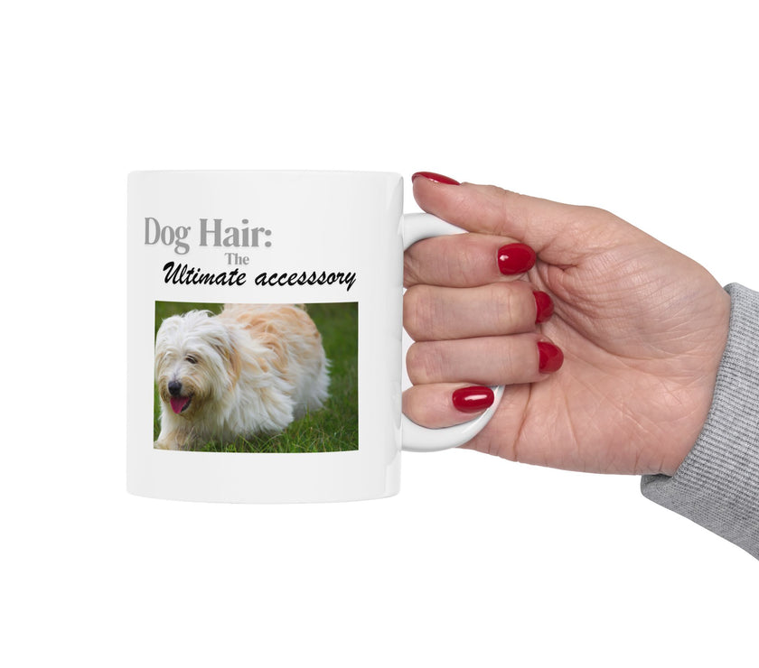 White ceramic mug featuring a photo of dogs lying on grass, with the humorous quote "Dog Hair: The Ultimate Accessory" printed below the image.