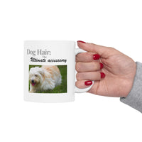 White ceramic mug featuring a photo of dogs lying on grass, with the humorous quote "Dog Hair: The Ultimate Accessory" printed below the image.