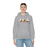 Person wearing a gray hoodie with Halloween-themed design on a white background