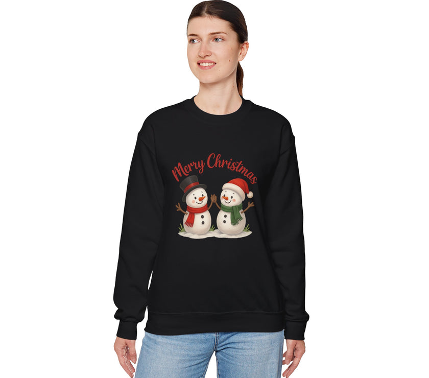 Person wearing a black Christmas-themed sweatshirt with snowmen graphics on a white background