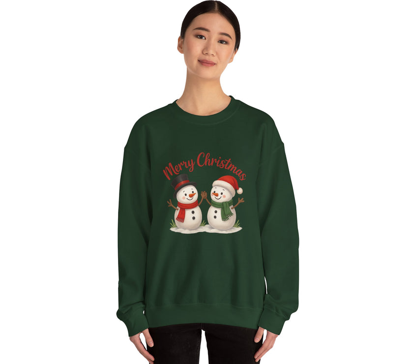 Person wearing a green Christmas-themed sweatshirt with snowmen and 'Merry Christmas' text.