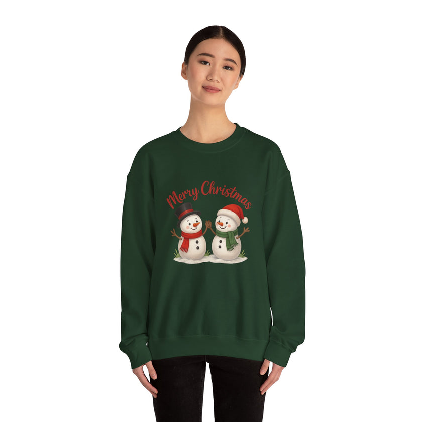 Person wearing a green Christmas-themed sweatshirt with snowmen and 'Merry Christmas' text.