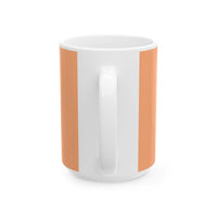 White mug with orange handles on a white background