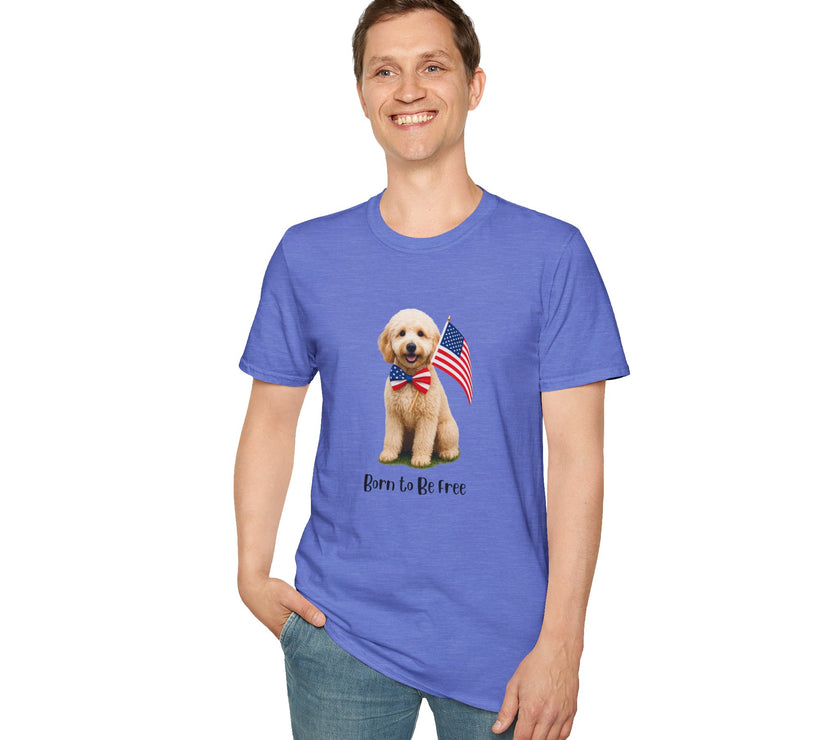 Male wearing T-shirt featuring a cute golden doodle puppy wearing an American flag bow tie and holding a small U.S. flag, with the phrase 'Born to Be Free' printed below the image.