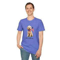 Male wearing T-shirt featuring a cute golden doodle puppy wearing an American flag bow tie and holding a small U.S. flag, with the phrase 'Born to Be Free' printed below the image.