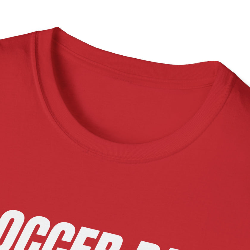 Close-up of a red shirt with white text on a white background