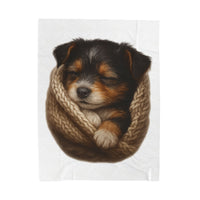 Blanket with Puppy wrapped in a knitted blanket on a white 