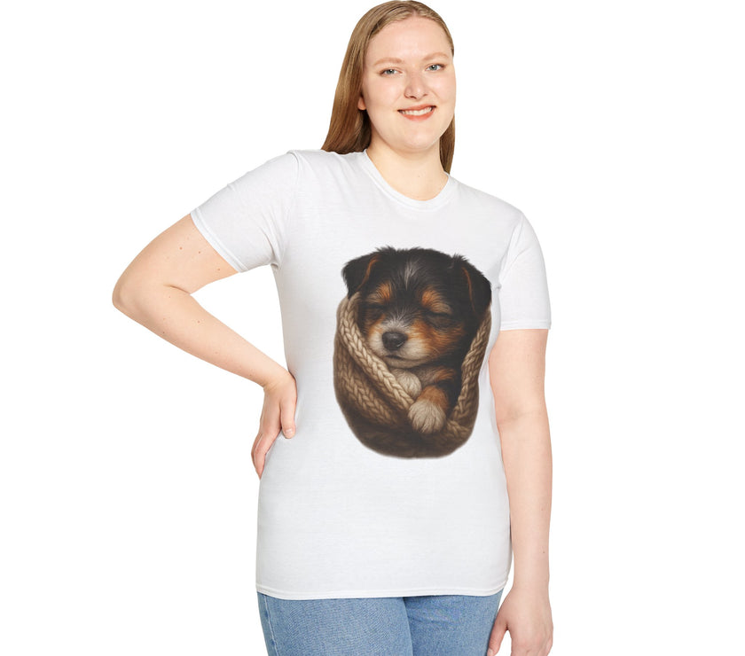 Person wearing a white t-shirt with a graphic of a dog in a knitted ball on a white background