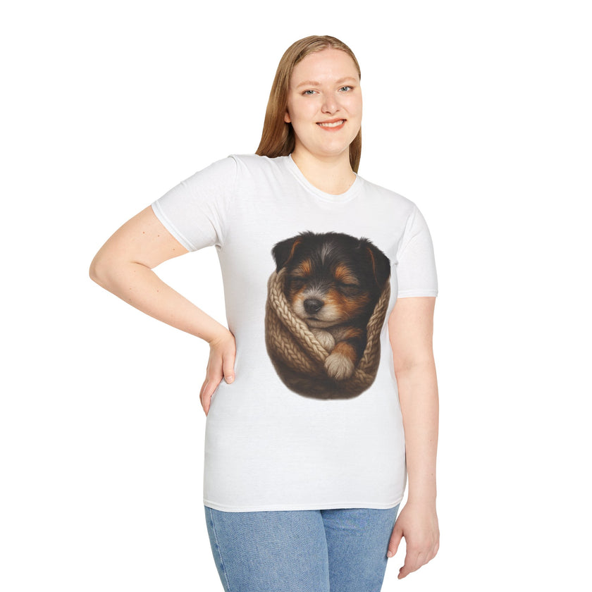 Person wearing a white t-shirt with a graphic of a dog in a knitted ball on a white background