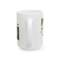 White ceramic mug featuring a photo of dogs lying on grass, with the humorous quote "Dog Hair: The Ultimate Accessory" printed below the image.