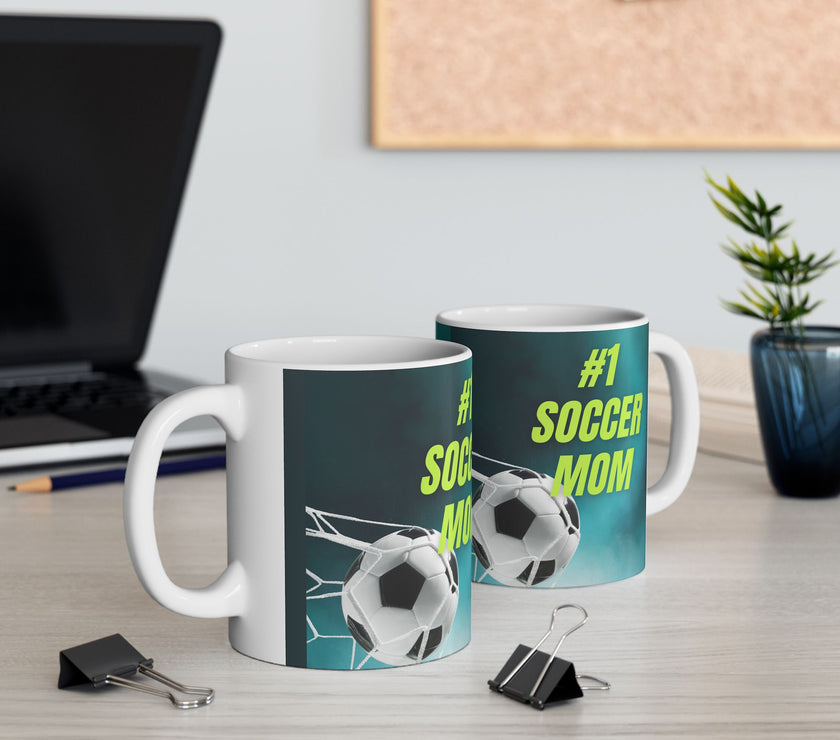 Mug with '#1 Soccer Mom' text and soccer ball design on a teal background