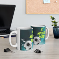 Mug with '#1 Soccer Mom' text and soccer ball design on a teal background