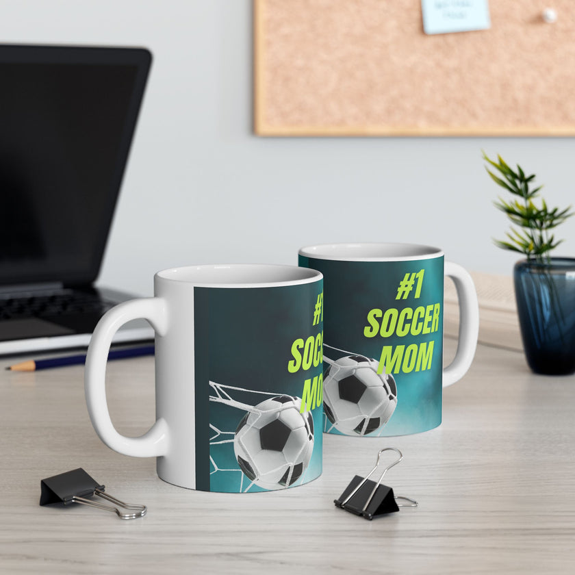 Mug with '#1 Soccer Mom' text and soccer ball design on a teal background