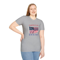 Female wearing T-shirt featuring an American flag graphic with the words 'AMERICAN DREAM' in red and blue text above and below the flag