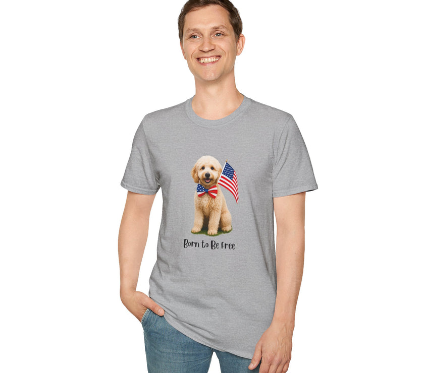 Male wearing T-shirt featuring a cute golden doodle puppy wearing an American flag bow tie and holding a small U.S. flag, with the phrase 'Born to Be Free' printed below the image.