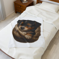 Blanket with a dog design draped over a bed in a bedroom setting.