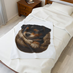 Blanket with a dog design draped over a bed in a bedroom setting.