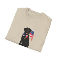 Sand t-shirt featuring a patriotic Black Lab wearing an American flag bowtie and holding U.S. flags, with the Black Labphrase "Born to Be Free" printed below — perfect for dog lovers and patriotic Americans.