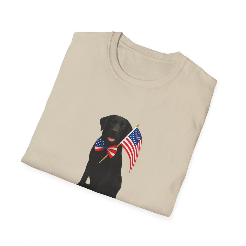 Sand t-shirt featuring a patriotic Black Lab wearing an American flag bowtie and holding U.S. flags, with the Black Labphrase "Born to Be Free" printed below — perfect for dog lovers and patriotic Americans.