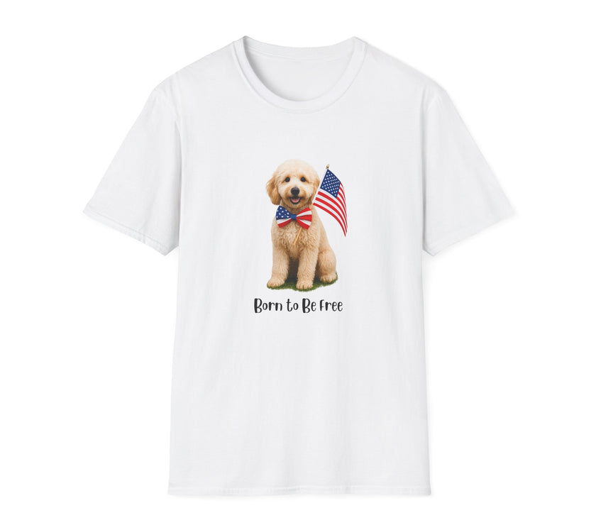 White t-shirt featuring a cute golden doodle puppy wearing an American flag bow tie and holding a small U.S. flag, with the phrase 'Born to Be Free' printed below the image.