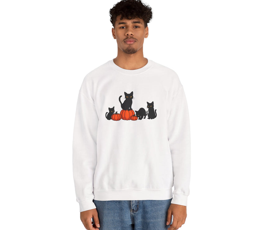 Person wearing a white sweatshirt with black cat and orange pumpkin design on a white background