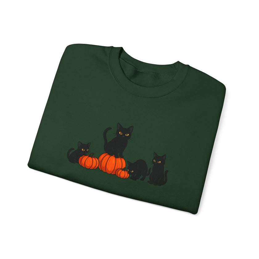 Folded green sweatshirt with black cats and pumpkins design on a white background