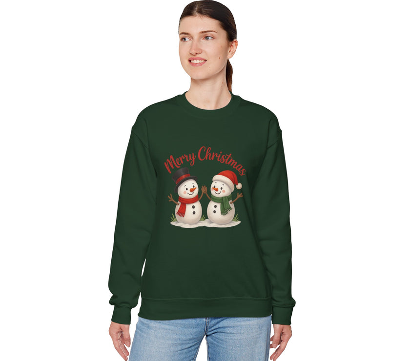 Person wearing a green Christmas-themed sweatshirt with snowmen and 'Merry Christmas' text on a white background.