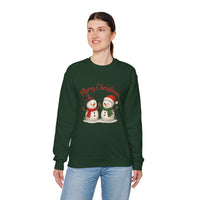 Person wearing a green Christmas-themed sweatshirt with snowmen and 'Merry Christmas' text on a white background.