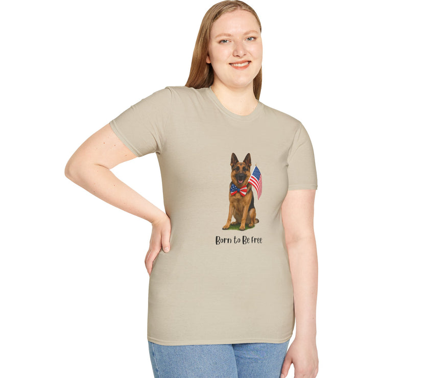 Beige t-shirt featuring a patriotic German Shepherd wearing an American flag bowtie and holding U.S. flags, with the phrase "Born to Be Free" printed below — perfect for dog lovers and patriotic Americans.