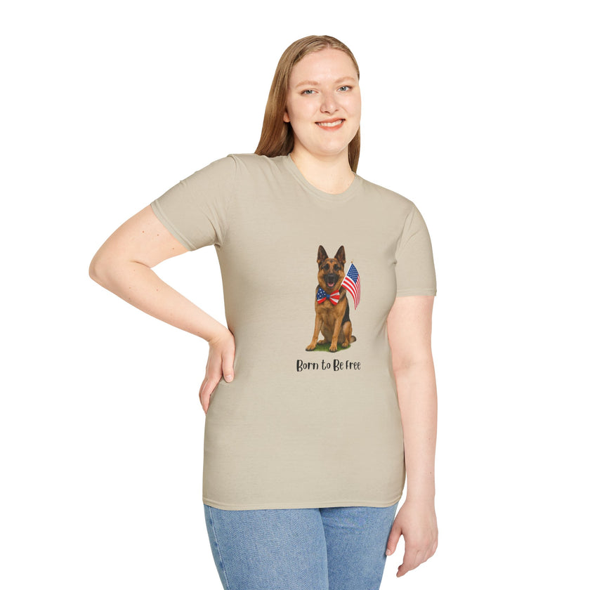 Beige t-shirt featuring a patriotic German Shepherd wearing an American flag bowtie and holding U.S. flags, with the phrase "Born to Be Free" printed below — perfect for dog lovers and patriotic Americans.