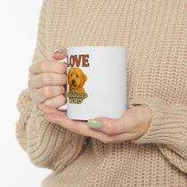 Person holding a mug with a dog illustration and text 'LOVE is a four-legged word' against a beige background