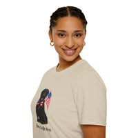 Sand t-shirt featuring a patriotic Black Lab wearing an American flag bowtie and holding U.S. flags, with the Black Labphrase "Born to Be Free" printed below — perfect for dog lovers and patriotic Americans.