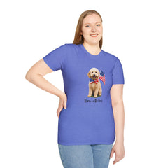 Female wearing T-shirt featuring a cute golden doodle puppy wearing an American flag bow tie and holding a small U.S. flag, with the phrase 'Born to Be Free' printed below the image.