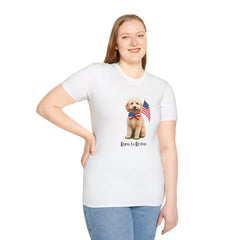 Female wearing T-shirt featuring a cute golden doodle puppy wearing an American flag bow tie and holding a small U.S. flag, with the phrase 'Born to Be Free' printed below the image.