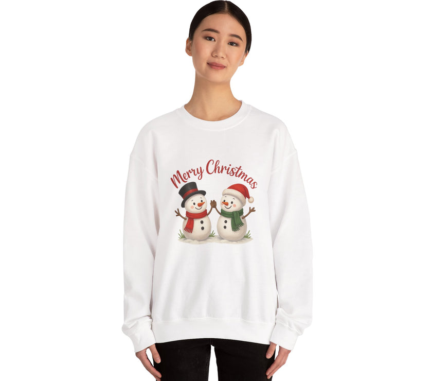 White sweatshirt with snowmen and 'Merry Christmas' text worn by a person on a white background