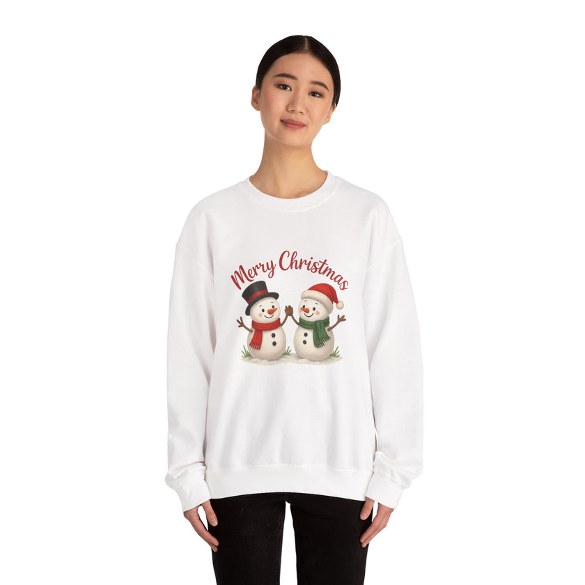 White sweatshirt with snowmen and 'Merry Christmas' text worn by a person on a white background